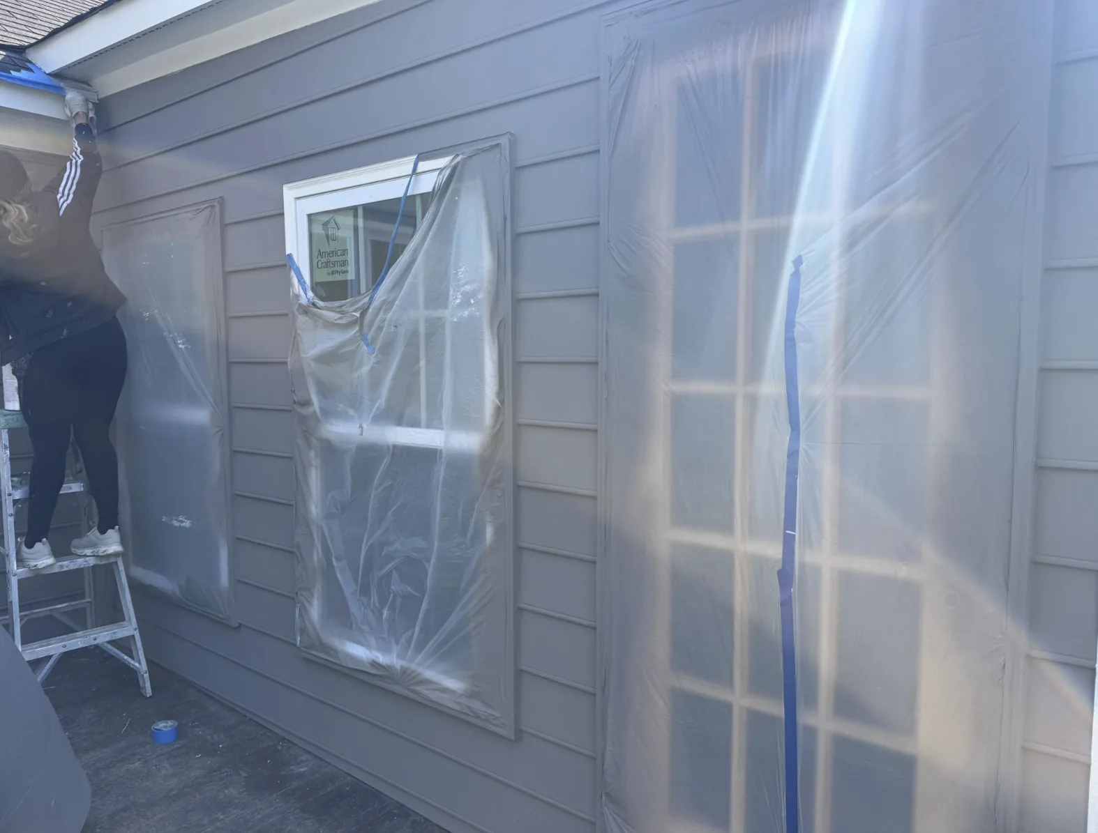 Completed residential home addition by HQ Construction & Remodeling with new exterior walls, windows and siding